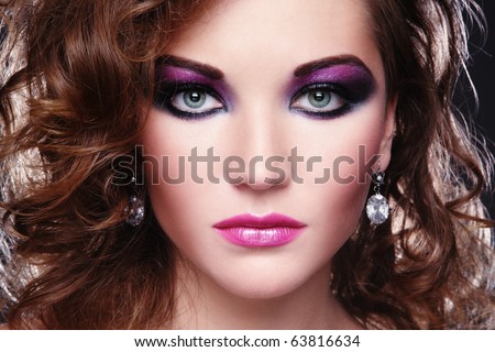  young girl with glowing colorful disco make-up and curly hairstyle