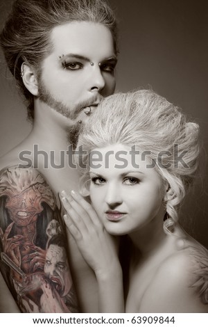 stock photo Duotone portrait of pierced tattooed man and woman with 