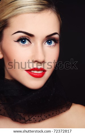 Portrait of young beautiful blond smiling woman with classical glamorous make-up