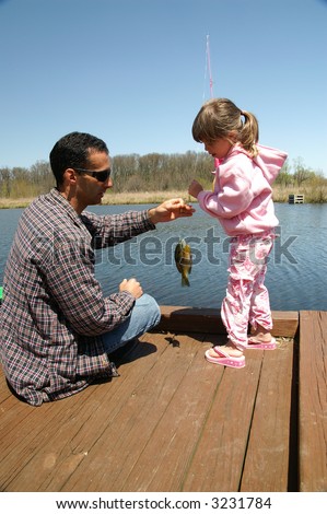 A father and daughter go fishing