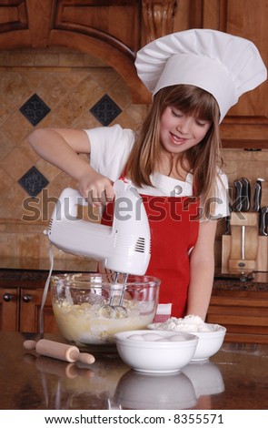 A cute young girl mixing cake mix for cupcakes