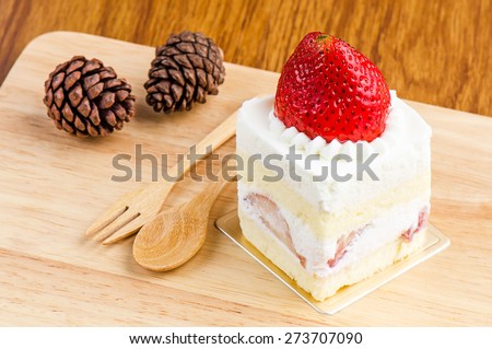 Strawberry cake on wooden background, Cake with strawberries, Piece of cake.