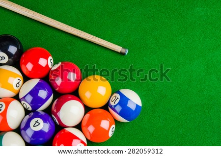 Billiard balls on green table with billiard cue, Snooker, Pool game.
