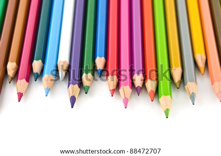 Set of colorful color pencil lined in row on white background.