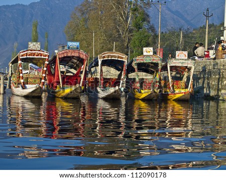 KASHMIR, INDIA-APRIL 10: Dal lake, the tourist attractive destination in northern India. People use \'Shikara\