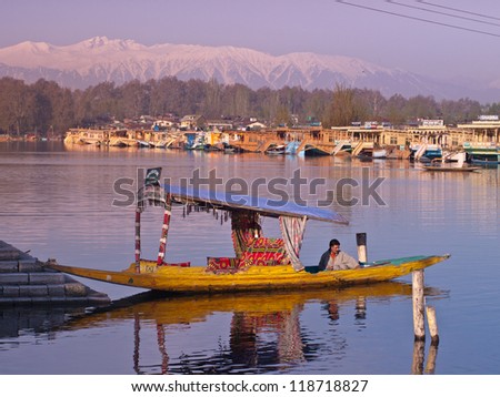 KASHMIR, INDIA-APRIL 10: Dal lake, tourist attractive destination in northern India. People use \'Shikara\
