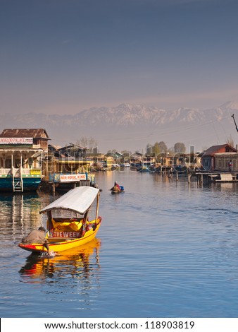 KASHMIR, INDIA-APRIL 10: Dal lake, tourist attractive destination in northern India. People use \'Shikara\