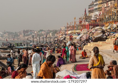 VARANASI, INDIA - APRIL 18: Crowd of local Indian live their morning life with Ganga river on April 18, 2010 in Varanasi, India. The most holy river of India and Hindu culture.