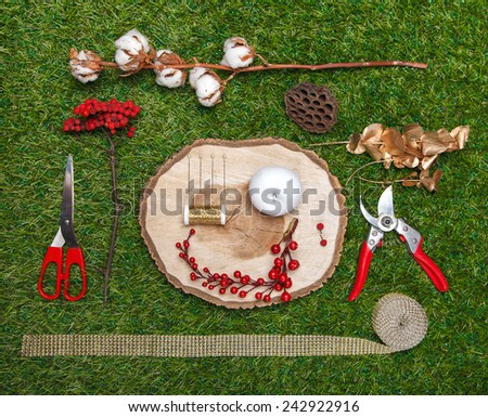 composition consisting of decorative elements and tools florist on the green background