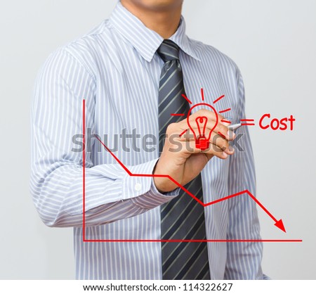 business man writing cost reduction concept