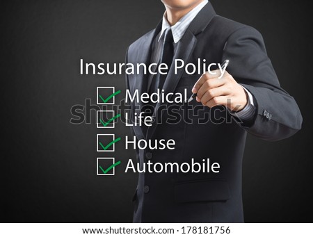 Business man writing life insurance policy