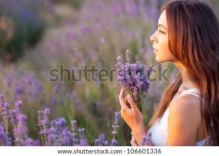 smiling beautiful brunette in the lavender field