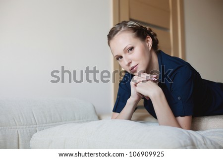 Beautiful woman lying on the bed at home