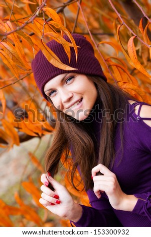 Young woman in autumn peach garden