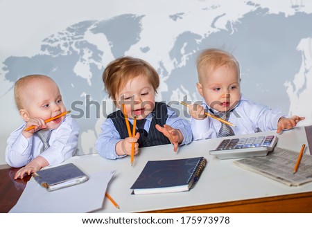 Three little businessman portrait in office