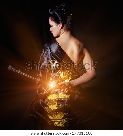 Woman with japan sword katana in hands