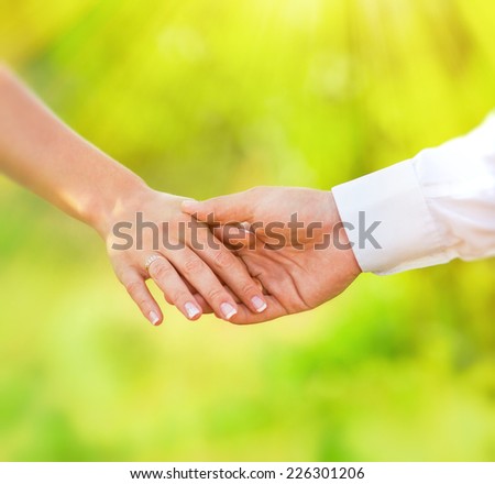 Hands of married man and woman
