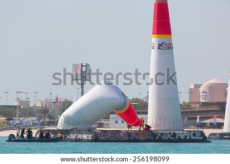 ABU-DHABI, UNITED ARABIAN EMIRATES - FEBRUARY 14 . Technical staff recovering inflatable gate at the stage of redbull airrace competition on february 14, 2015 in Abu-Dhabi, United Arabian Emirates