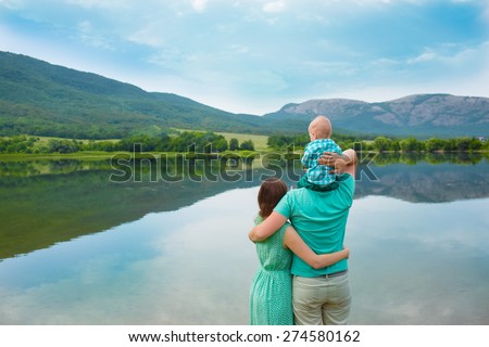 Family resting on the lake