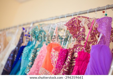 A few beautiful wedding or evening dresses on a hanger