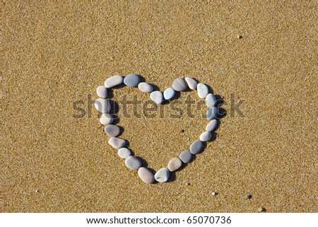 the heart is lined with stones on the sand