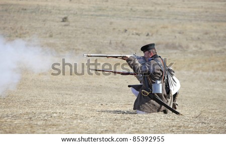 SEVASTOPOL, UKRAINE - SEPTEMBER 25 Russian carabiner shooting his rifle on reconstruction of \