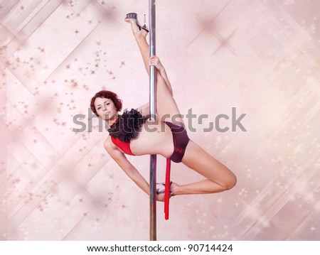 Girl making figure of pole-dance sport