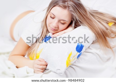 Young beautiful girl sleeping on the pillow