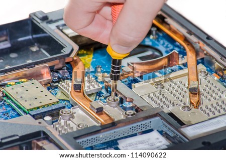 Laptop repair. The specialist conducts repairs laptop motherboard plans