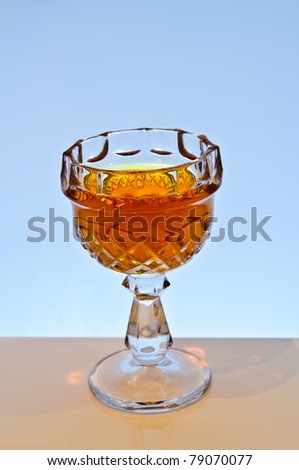Glass of liquor. Subject to the uniform background