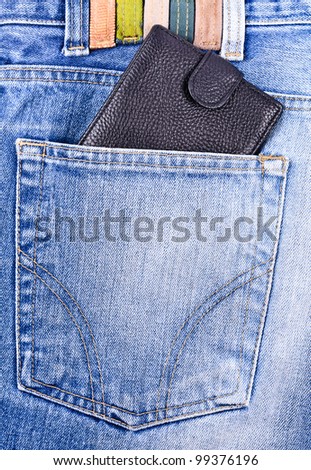 Wallet in the pocket of jeans. Close-up Photos