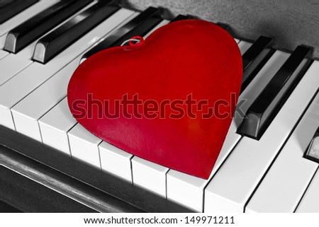 Red heart on a piano