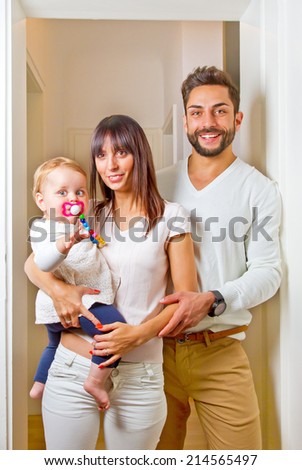 Family standing in a door frame