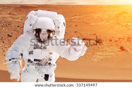 Astronaut on planet mars - Elements of this image furnished by NASA