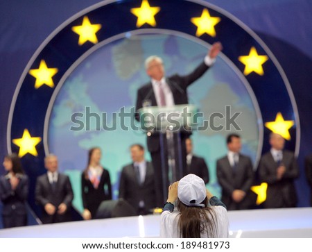 SOFIA, BULGARIA - APRIL 27: Supporter of EPP takes a picture of candidate for the post of EC President Jean-Claude Juncker during opening of the EU elections campaign on April 27, 2014 in Sofia.
