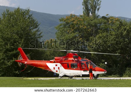 Red and white ambulance helicopter ready to takes off