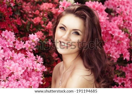 Horizontal portrait. Beautiful female. Model in flowers. Spring seasonal look