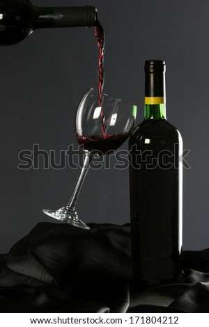 Red wine poured into wine glass