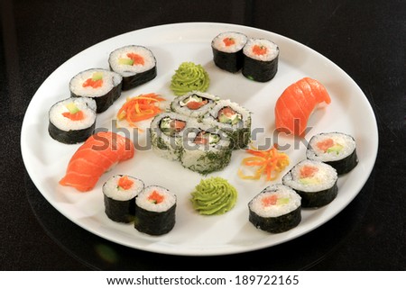 Sushi Set. Different Types of  Sushi on White Plate