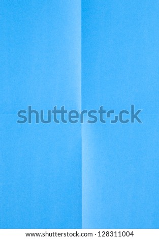 blue sheet of paper folded in four