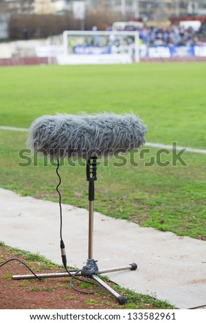 large microphone boom for tv at a football stadium
