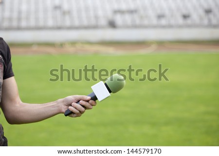 Reporter takes interview after the match