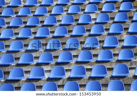 plastic blue seats on football stadium