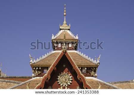 Unique rooftop of Thailand temple. That being repaired.