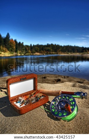 Assortment of Salmon fishing flies and fly rod along the Cains river in Blackville, New Brunswick.