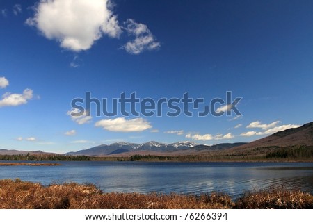 Cherry pond with Presidential range in background.  New Hampshire