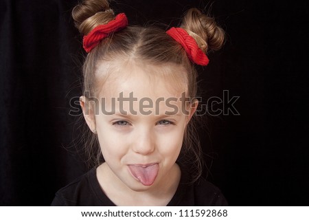 Little Girl Sticking Out Tongue