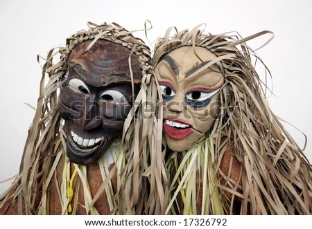 People wearing masks of indigenous people.