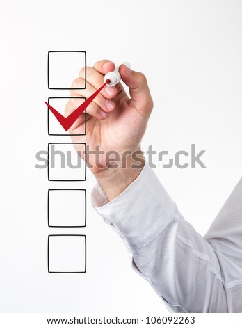Human hand checking the checklist boxes Human hand checking the checklist boxes