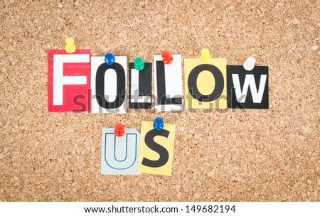 Follow Us pinned on cork bulletin board Follow Us pinned on cork bulletin board